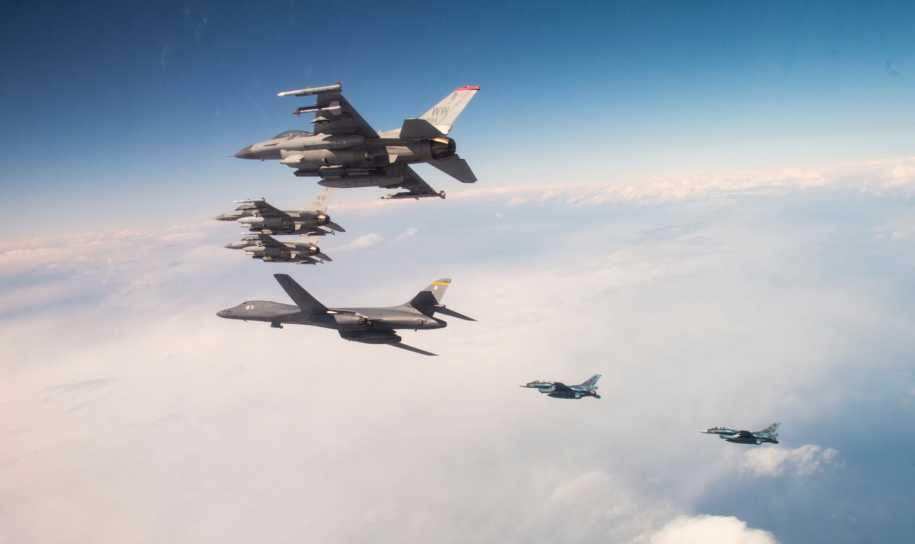 A U.S. Air Force B-1B Lancer from Ellsworth Air Force Base, S.D. and F-16 Fighting Falcons from Misawa Air Base, Japan, conducted bilateral joint training with Japan Air Self-Defense Force (JASDF) F-2s off the coast of Northern Japan, April 22, 2020. U.S. Strategic Command's bomber forces regularly conduct combined theater security cooperation engagements with allies and partners, demonstrating U.S. capability to command, control and conduct bomber missions around the world. (U.S. Air Force photo by Tech. Sgt. Timothy Moore)