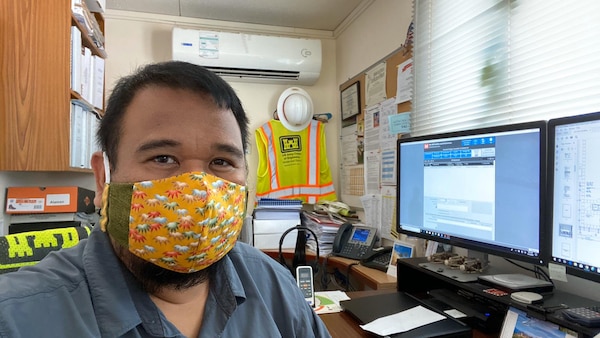 Mechanical Engineer Ryan Alaman rocks his reversible face cover, thanks to Emma Wanamaker, wife of CPT Grant Wanamaker, who made face covers for everyone in the Bahrain Resident Office.