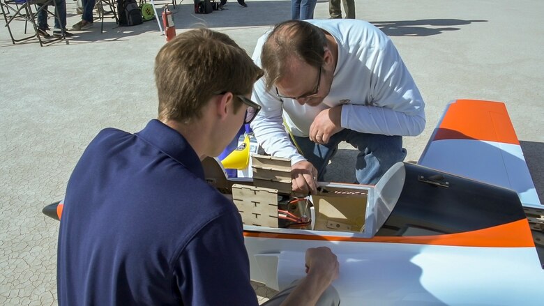 Members of 412th Test Wing’s Emerging Technology Combined Test Force, prepare a Bob Violett Models “Renegade” aircraft prior to a flight test on Edwards Air Force Base, California, March 4. (Air Force photo by Chris Dyer)