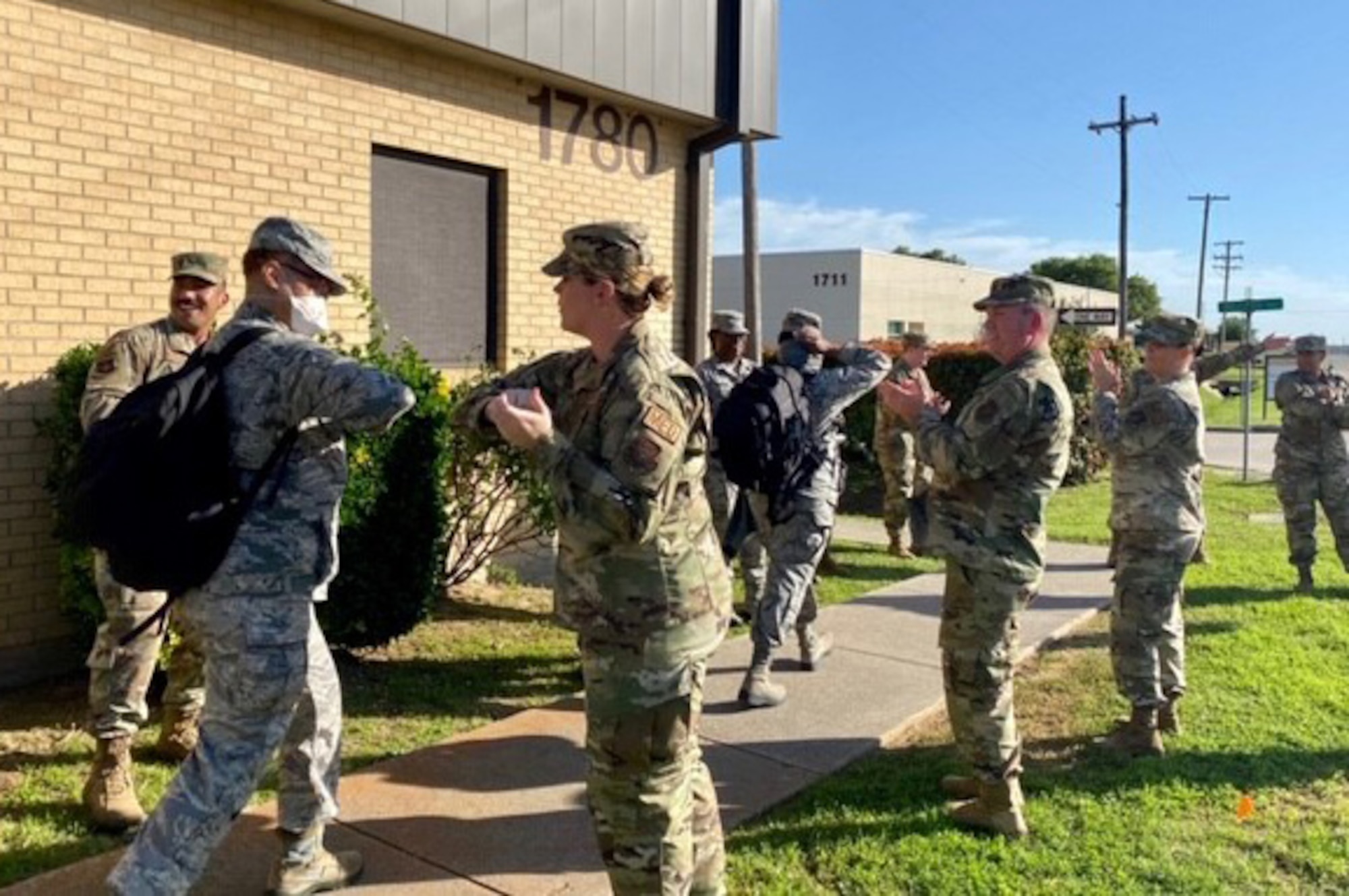 Airmen cheer on 301st Medical Squadron personnel as they prepare to depart U.S. Naval Air Station Joint Reserve Base, Fort Worth, Texas, in support of the nation’s COVID-19 response on April 22, 2020. This deployment is part of a larger mobilization package of more than 770 Air Force Reservists from across the nation who are taking care of Americans fighting COVID-19. (U.S. Air Force photo by Capt. Jessica Gross)