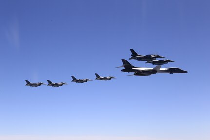 A U.S. Air Force B-1B Lancer from Ellsworth Air Force Base, S.D. and F-16 Fighting Falcons from Misawa Air Base, Japan, conducted bilateral joint training with Japan Air Self-Defense Force (JASDF) F-2s and F-15s off the coast of Northern Japan, April 22, 2020. U.S. Strategic Command's bomber forces regularly conduct combined theater security cooperation engagements with allies and partners, demonstrating U.S. capability to command, control and conduct bomber missions around the world. (Courtesy photo by the Japan Air-Self Defense Force)