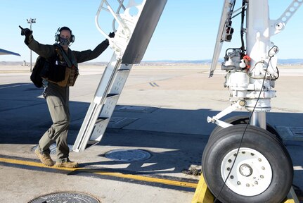 U.S. Air Force Capt. Lance Huston, a 37th Bomb Squadron weapons systems officer, prepares to board a B-1B Lancer at Ellsworth Air Force Base, S.D., April 21, 2020. Aircrew from the 37th BS flew a B-1B Lancer from the continental United States and integrated with the Koku Jieitai (Japan Air Self Defense Force or JASDF) to conduct bilateral and theater familiarization training near Japan. (U.S. Air Force photo by Airman Quentin K. Marx)