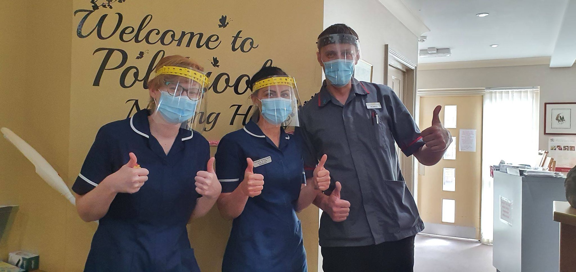 Polebroke Nursing and Residential Home staff members pose for a group photo wearing face shields donated by James Anderson in Polebrook, England, April 17, 2020. (Courtesy photo)