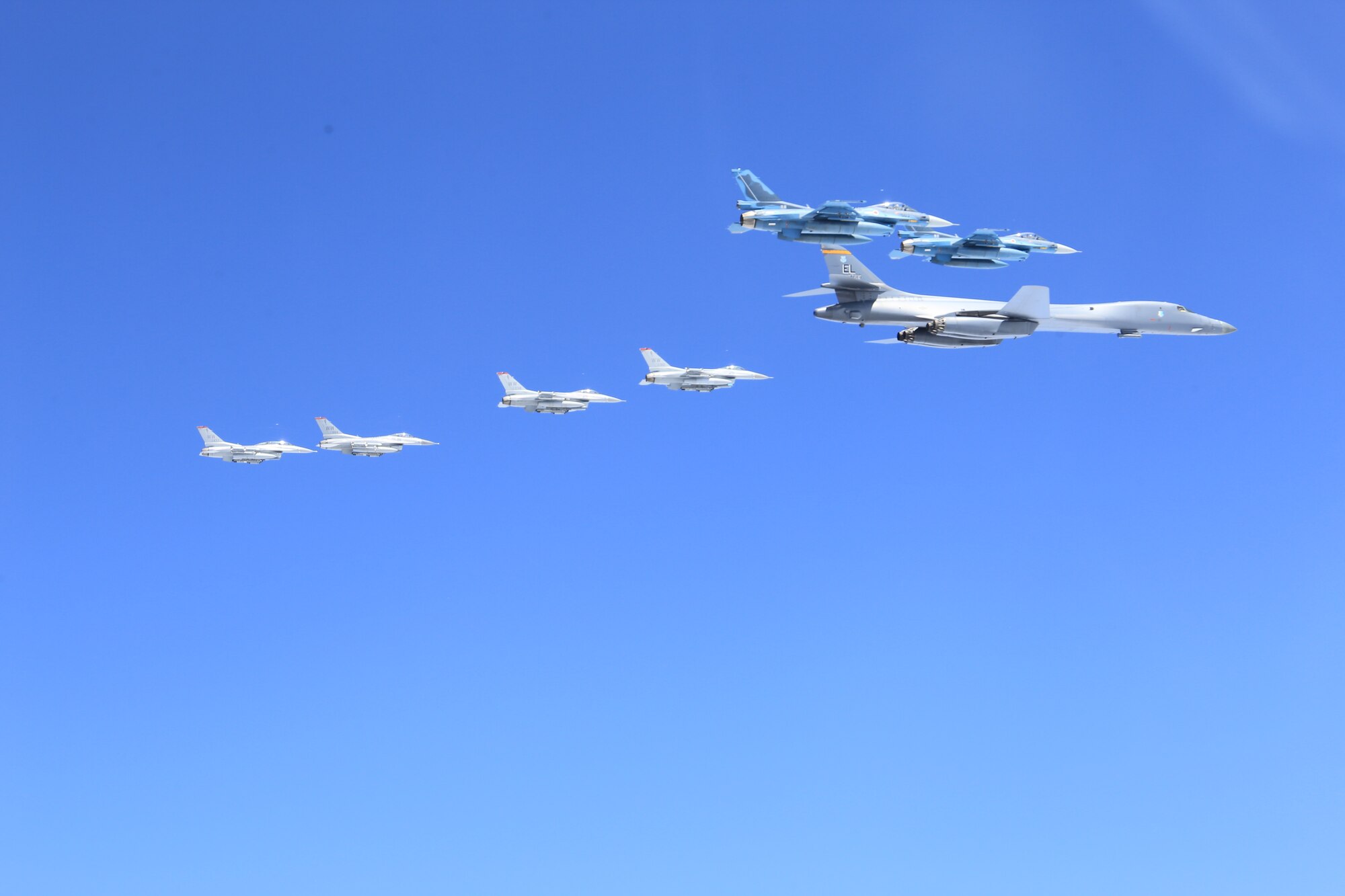 A U.S. Air Force B-1B Lancer from Ellsworth Air Force Base, S.D. and F-16 Fighting Falcons from Misawa Air Base, Japan, conducted bilateral joint training with Japan Air Self-Defense Force (JASDF) F-2s and F-15s off the coast of Northern Japan, April 22, 2020. U.S. Strategic Command's bomber forces regularly conduct combined theater security cooperation engagements with allies and partners, demonstrating U.S. capability to command, control and conduct bomber missions around the world. (Courtesy photo by the Japan Air-Self Defense Force)