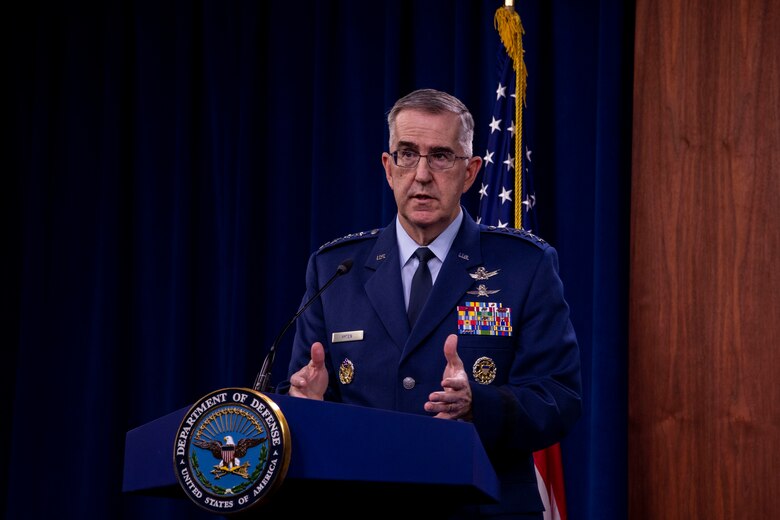 Air Force officer stands at lectern.