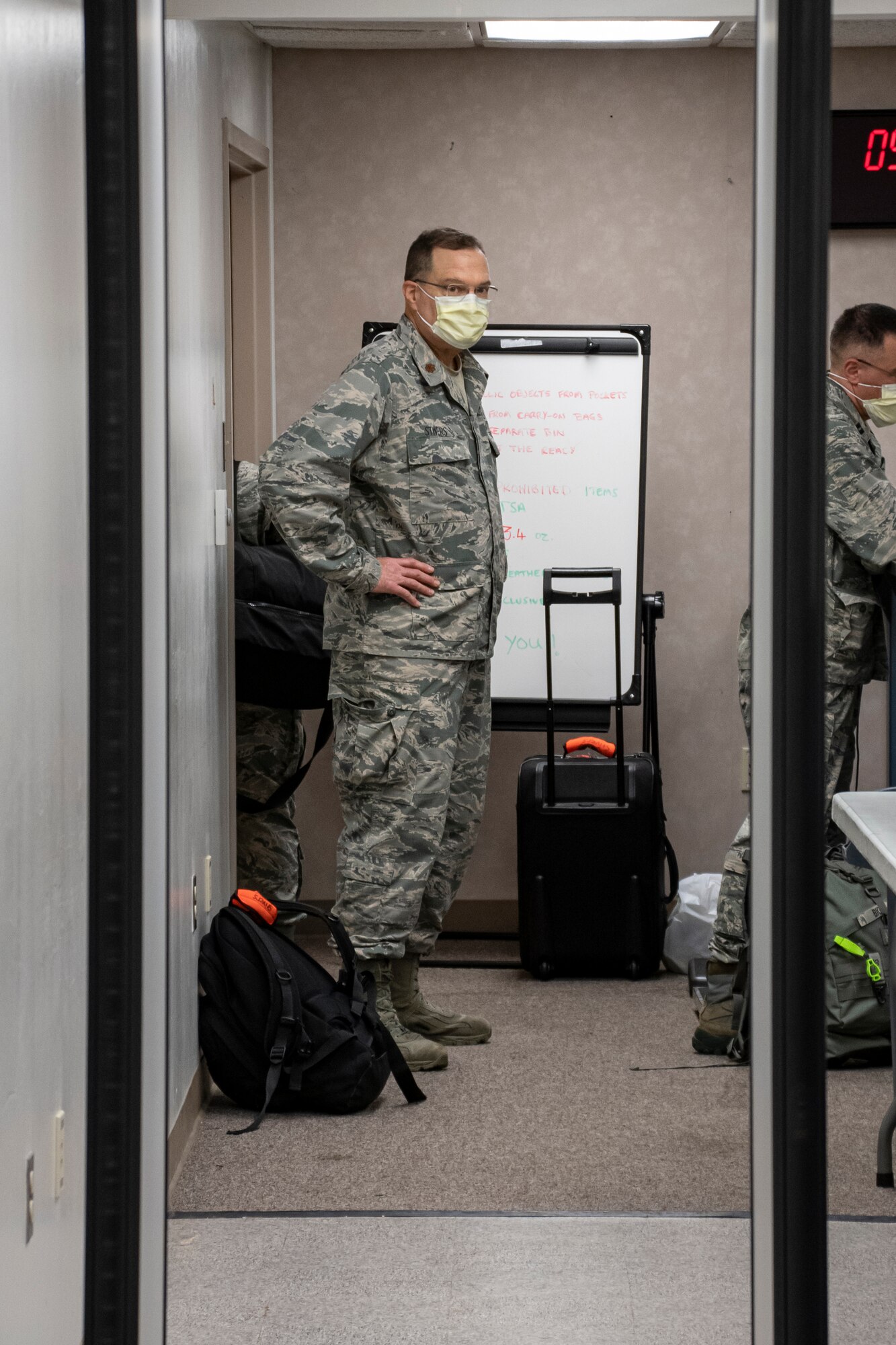 Airman looks at a metal detector