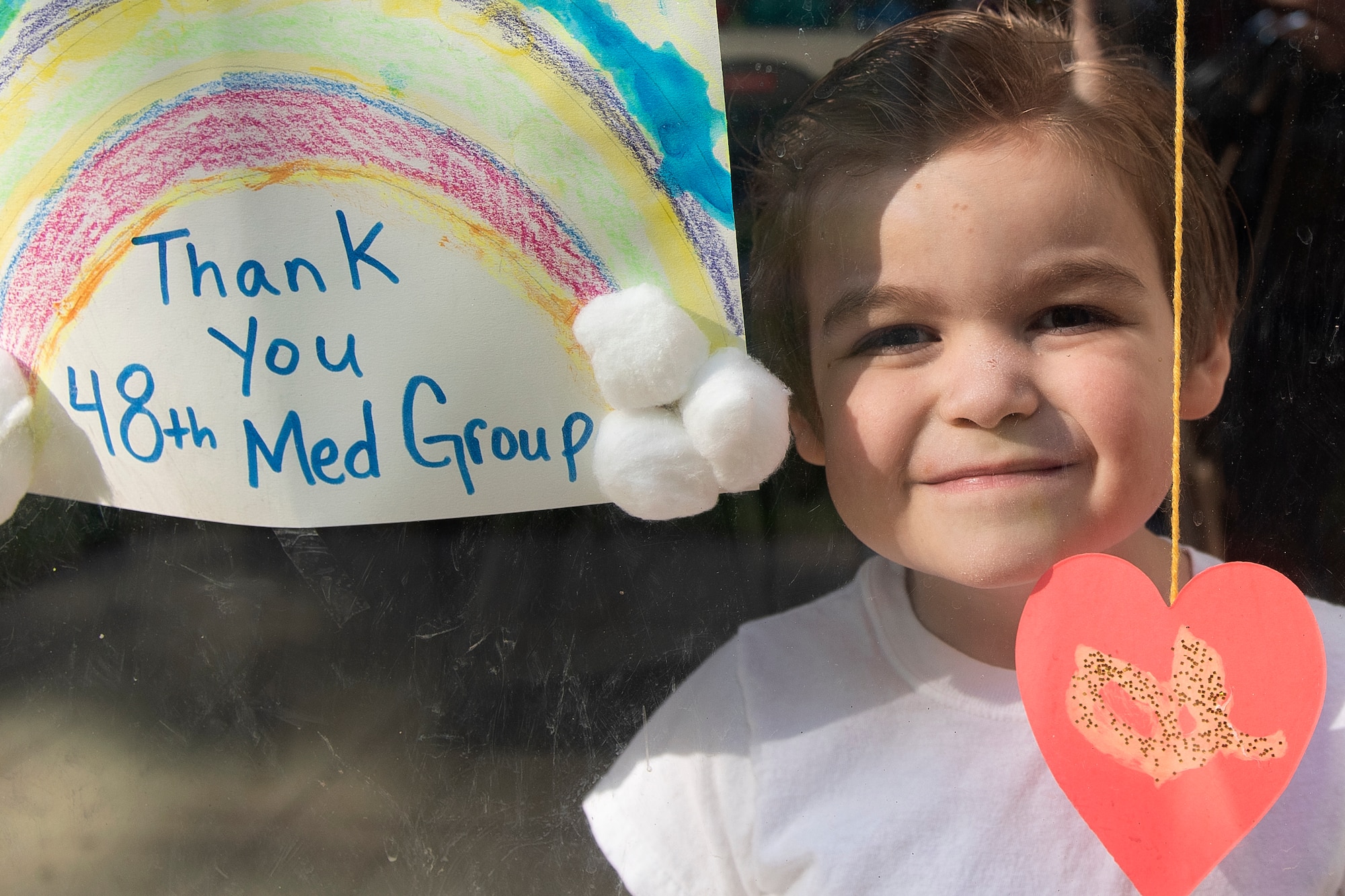 A child of a U.S. Air Force Airman displays artwork in their window in Liberty Village at Royal Air Force Lakenheath, England, April 22, 2020. The rainbow is a symbol of positivity and is often combined with a message of support for medical professionals serving on the front lines during the current COVID-19 crisis. (U.S. Air Force photo by Airman 1st Class Jessi Monte)