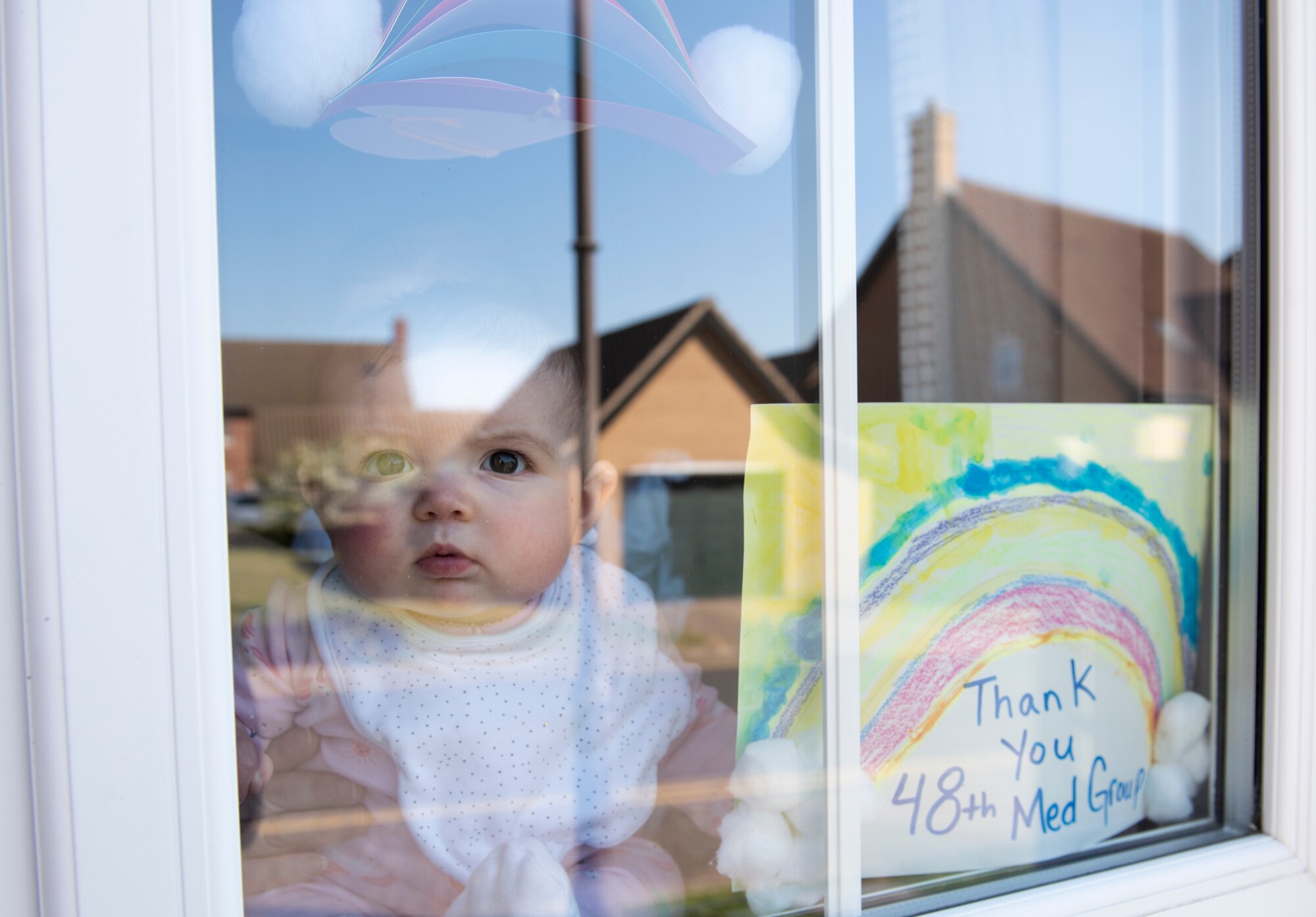 A child of a U.S. Air Force Airman displays rainbow artwork in their window in Liberty Village at Royal Air Force Lakenheath, England, April 22, 2020. The rainbow is a symbol of positivity and is often combined with a message of support for medical professionals serving on the front lines during the current COVID-19 crisis. (U.S. Air Force photo by Airman 1st Class Jessi Monte)