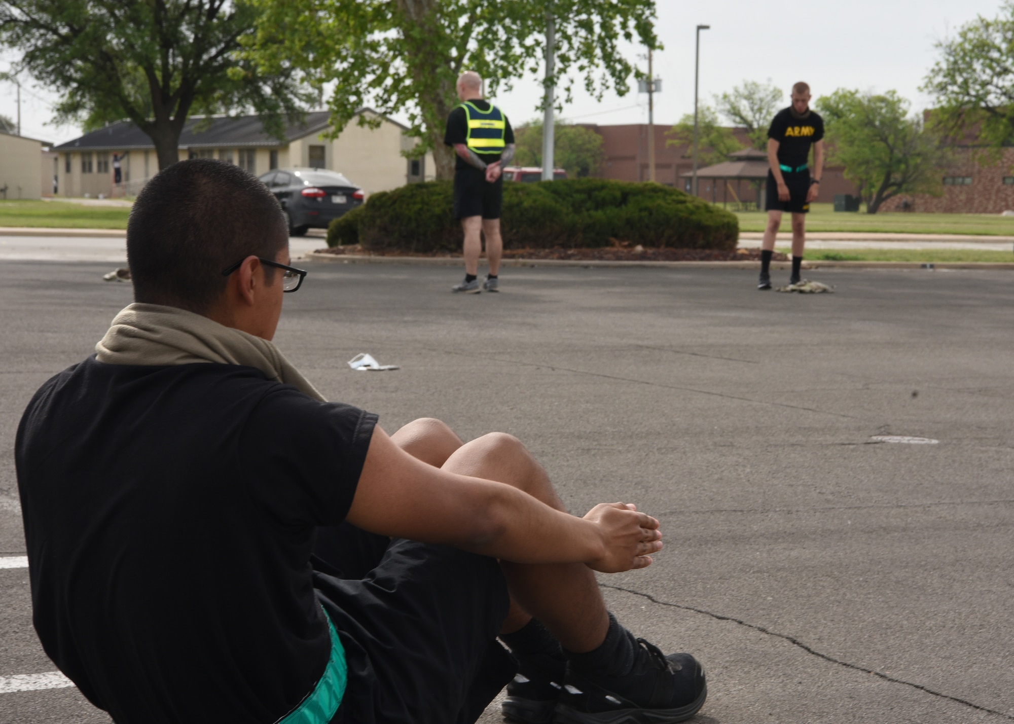 U.S. Army student from the 344th Military Intelligence Battalion Company C., strength trains during a mid-morning physical training session on Goodfellow Air Force Base, Texas, April 22, 2020. Army PT sessions complied with social distancing and wearing masks during the COVID-19 pandemic. (U.S. Air Force photo by Airman 1st Class Abbey Rieves)