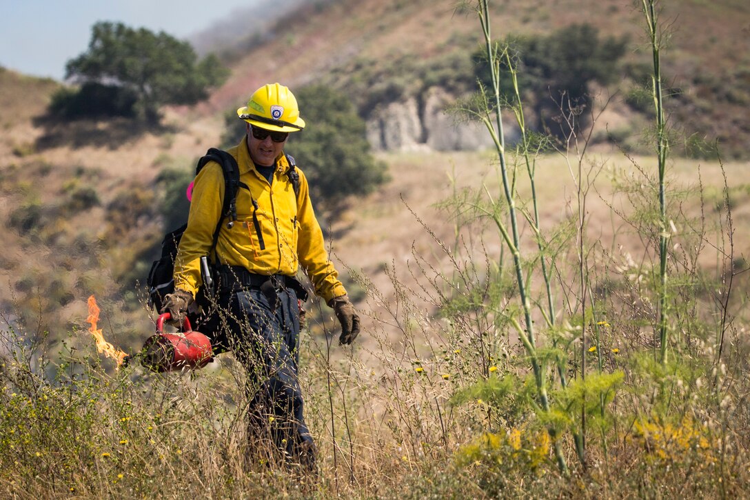 Firefighters initiate prescribed burns at Ranges 108 and 109 on Marine Corps Base Camp Pendleton, California, June 12.