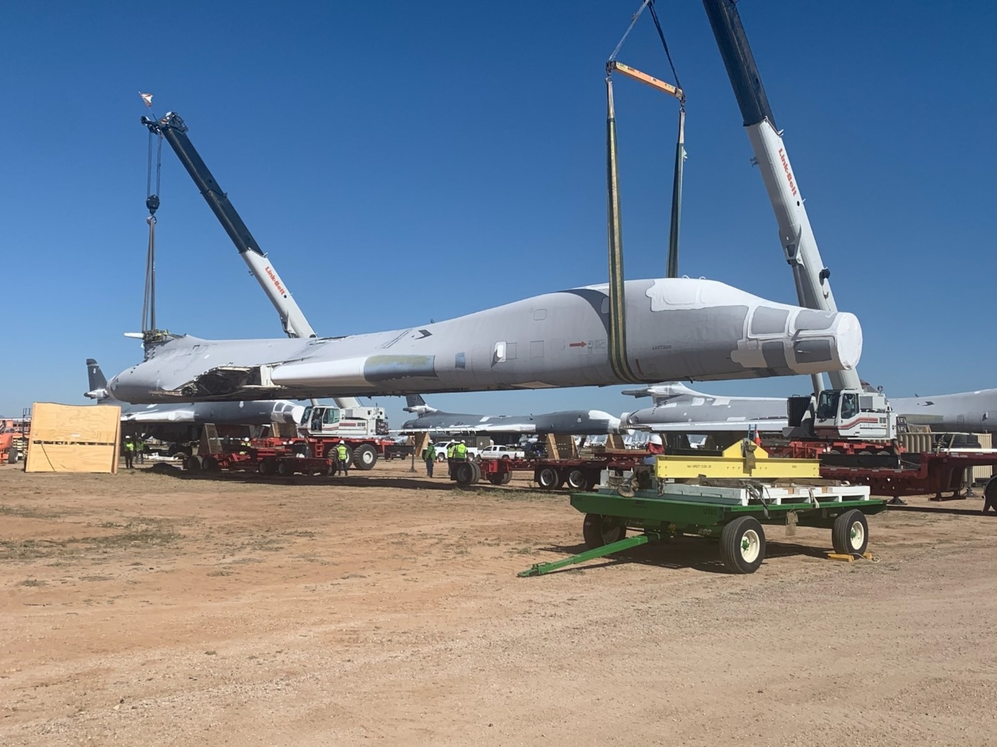 B-1B tail #85-0092 is lifted and placed on flatbed trailers for the 1,000 mile journey to Wichita, Kansas.  The National Institute for Aviation Research at Wichita State University will scan every part of the aircraft to create a digital twin that can be used for research.  (US Air Force Photo)