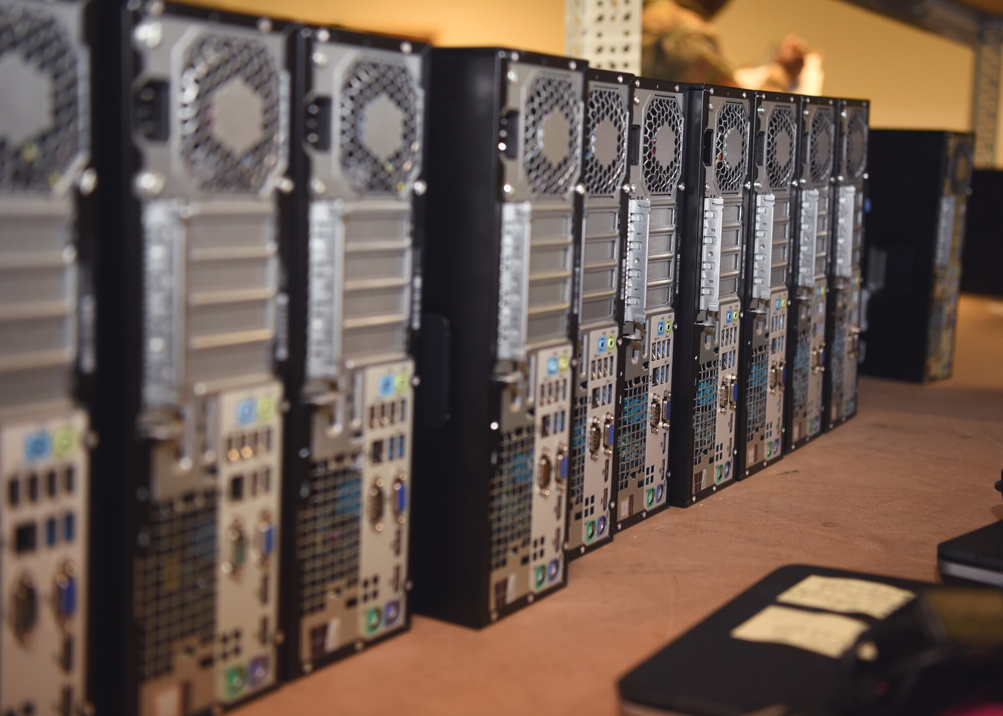 U.S. Air Force desktops line a shelf in the 17 Communications Squadron’s image lab, on Goodfellow Air Force Base, Texas, April 22, 2020.  The 17th CS readied over 200 mobile devices, allowing essential personnel work-from-home capabilities during the COVID-19 pandemic. (U.S. Air Force photo by Airman 1st Class Abbey Rieves)