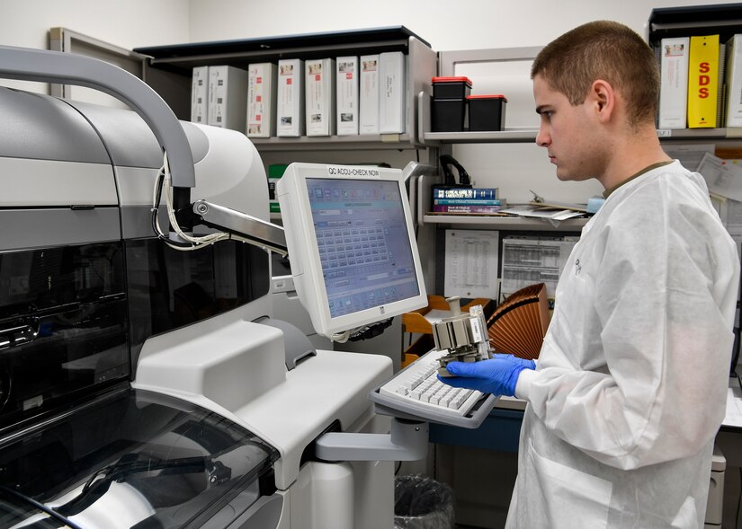 A photo of a medical lab technician performing a test.