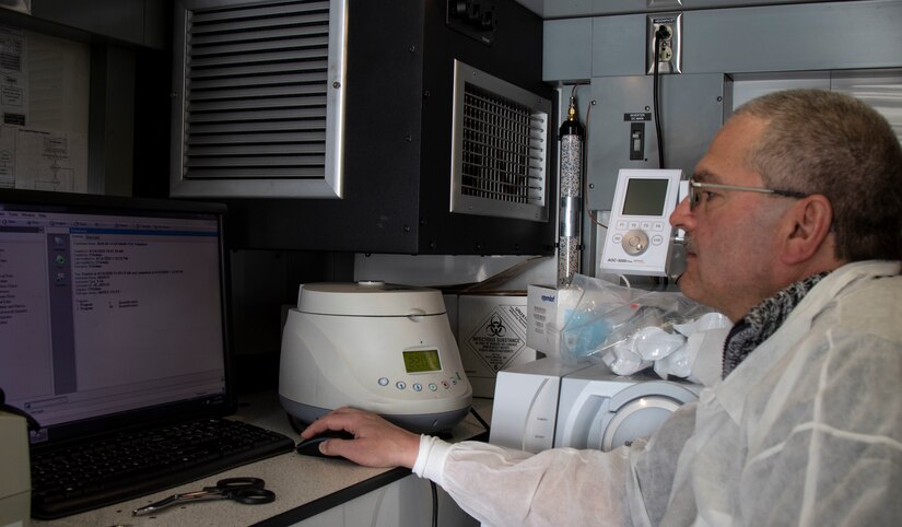 U.S. Army Reserve Maj. Dmitry Pervistky, a bio-chemist with the 773rd Civil Support Team, 7th Mission Support Command, from Kaiserslautern, Germany, conducts personal training and validation of an Analytical Laboratory System prior to testing Soldiers for Novel Coronavirus at Drawsko Pomorskie Training Area, Poland, April 14, 2020. A team of four Soldiers from the 773rd CST is charged with testing incoming personnel to ensure they are not introducing COVID to a relatively COVID-free environment. 

(U.S. Army Reserve photo by Staff Sgt. Chris Jackson/Released)