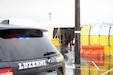 The next vehicle is directed into the testing tent at the COVID-19 testing site at Mohegan Sun Arena in Wlkes-Barre, Pa., on April 21, 2020. The testing site is run by the Pennsylvania Department of Health and Pennsylvani Emergency Management Agency, and supported by the Pa. National Guard and other state agencies. (U.S. Army photo by Sgt. 1st Class Matthew Keeler)