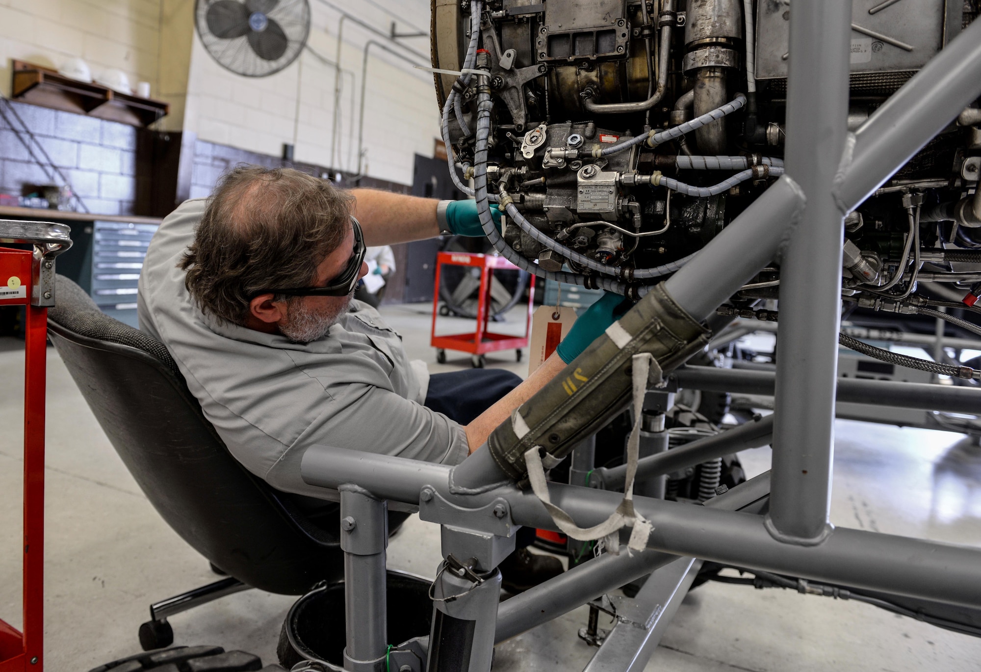 Frank Hall, M1 Support Services propulsion mechanic, performs maintenance on a General Electric J85-GE-5 turbojet engine April 17, 2020, at Columbus Air Force Base, Miss. Propulsion means to push or drive an object forward, and these engines help power the wing’s T-38 Talons. (U.S. Air Force photo by Airman 1st Class Davis Donaldson)