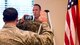 Officer administers the oath of enlistment to a recruit via live video at Otis Air National Guard Base, Mass.