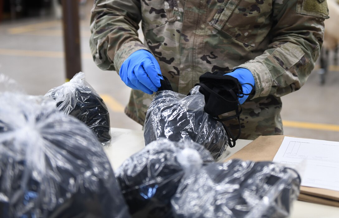 Tech. Sgt. Justin Lott, a 28th Logistics Readiness Squadron asset management section chief, prepares face masks for distribution to the base at the Flight Service Center on Ellsworth Air Force Base, S.D., April 21, 2020. The 28th Contracting Squadron ordered 7,300 face masks for base dissemination, in an effort to battle the COVID-19 pandemic. (U.S. Air Force photo by Airman 1st Class Christina Bennett)