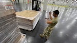 Soldiers with the New York Army National Guard’s 133rd Composite Supply Company move equipment while setting up an alternate care facility at the Jacob K. Javits Convention Center in New York City, March 25, 2020. The medical station can handle more than 4,000 patients and is staffed with more than 2,200 personnel from every branch of the U.S. military and city, state and federal agencies.