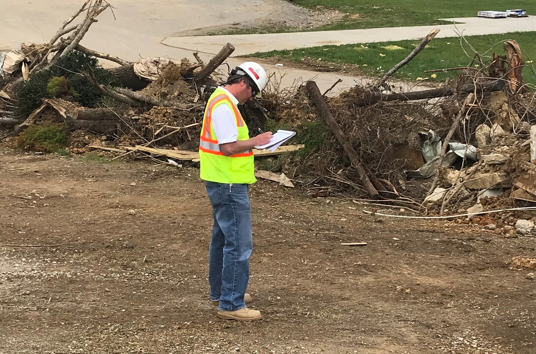Chad Braun, civil engineer with the U.S. Army Engineering and Support Center in Huntsville, Alabama, takes notes at a debris site in Putnam County, Tennessee, April 20, 2020 while supporting a USACE debris technical assistance mission from FEMA in the wake of tornadoes that devastated the region March 3. Braun is a former employee of the Nashville District, and volunteered to support this mission in the region he used to call home. (USACE Photo)