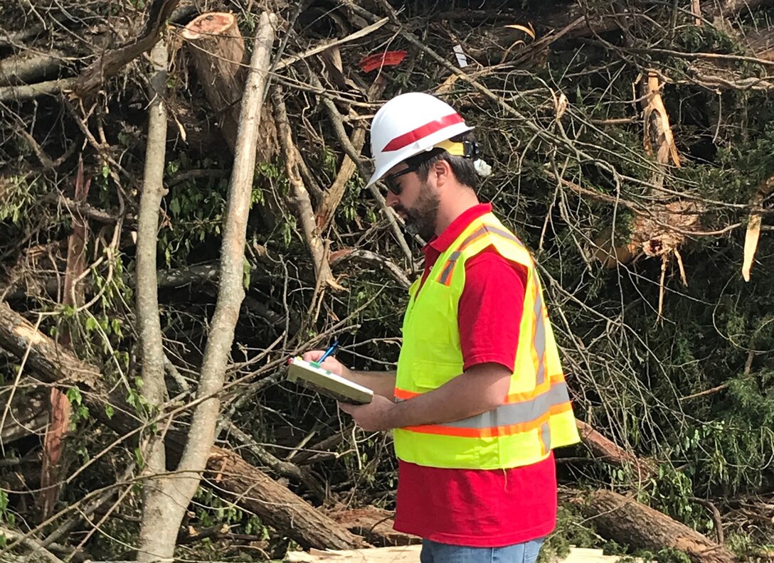 Herb Bullock, civil engineer with the Mobile District, takes notes at a temporary debris management site in Lebanon, Tennessee, April 19, 2020 while supporting a U.S. Army Corps of Engineers debris monitoring mission from FEMA in the wake of tornadoes that devastated the region March 3. (USACE Photo)