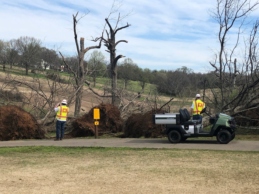 Robert Powers (Right), lead debris subject matter expert and construction representative with the Baltimore District, and Glenn Greiner, geodesist with the Mobile District, members of the Corps of Engineers' debris technical assistance team, observe debris strewn on the Shelby Golf Course in Nashville, Tennessee March 26, 2020. The damage was caused by a tornado that moved through the city March 3. (USACE Photo)