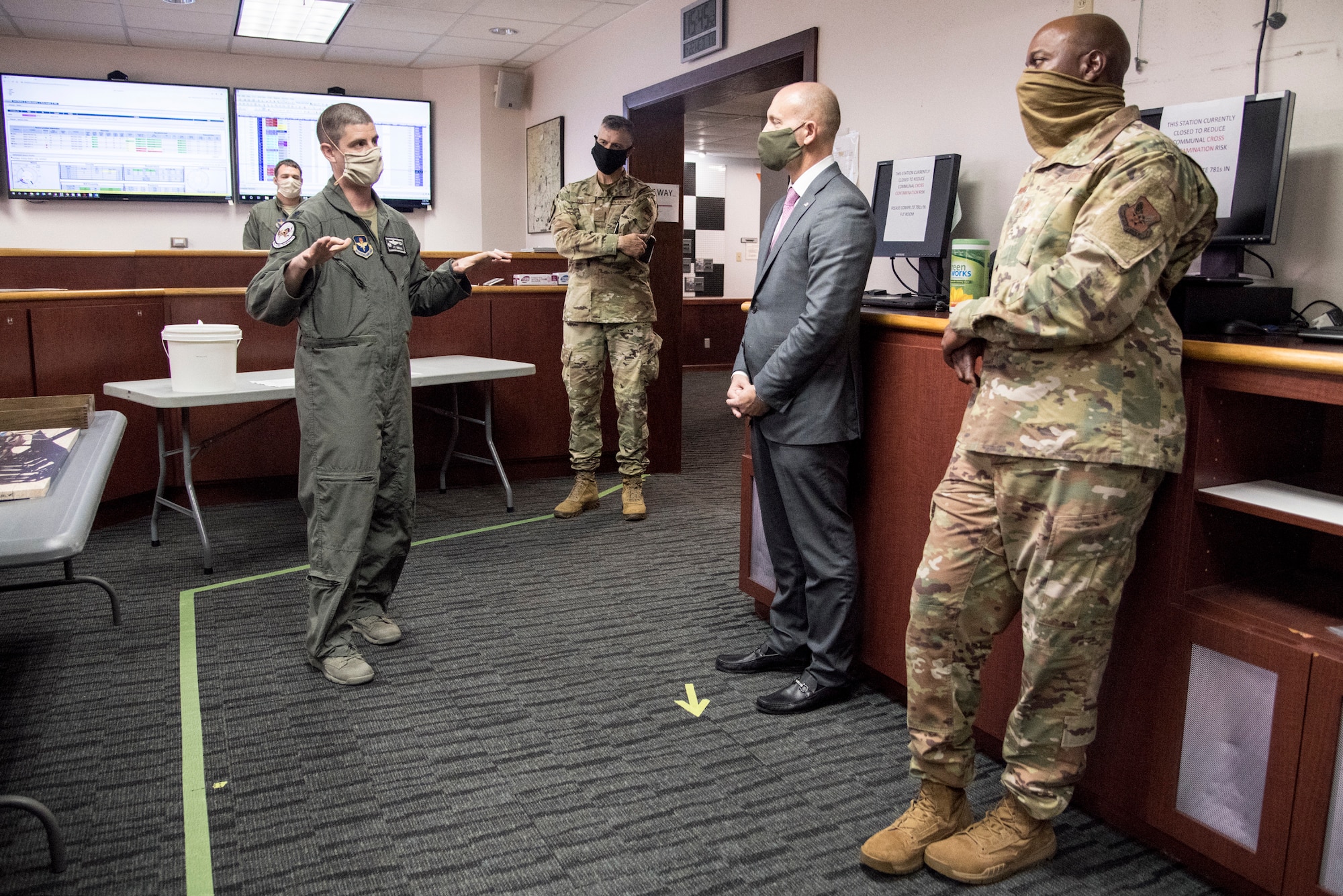 individuals in room listening to briefer