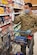 Tech. Sgt. Justin Aguilar, logistics test and evaluator, 412th Maintenance Logistics Test Squadron, shops for essentials at the Edwards Air Force Base commissary, April 22.  (Photo by Christian Turner)