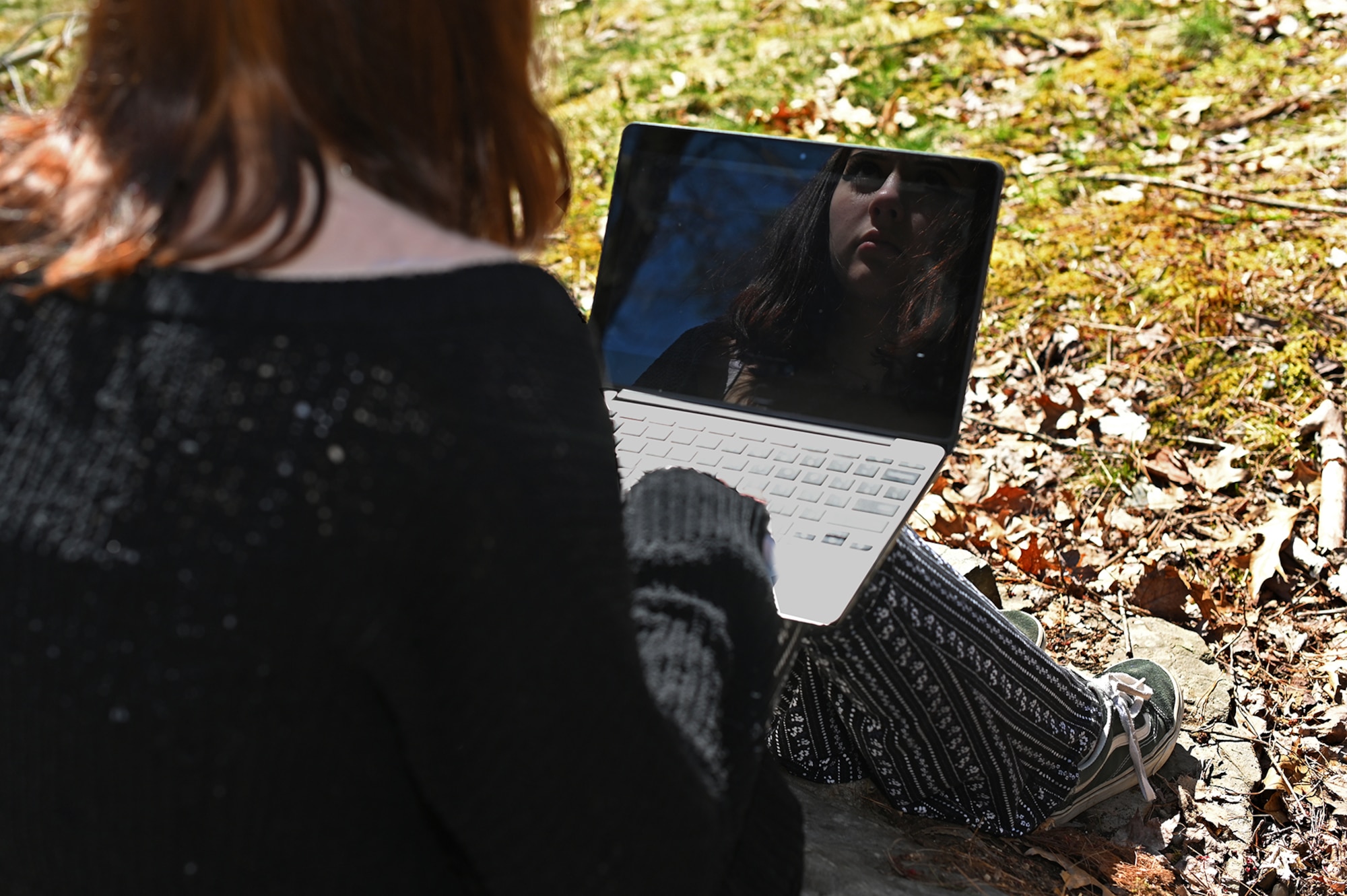 A high school student scrolls through social media at her home outside Hanscom Air Force Base, Mass., April 23. The 66th Medical Squadron Family Advocacy Program is counseling families of high school-aged children who are struggling with missing milestones due to COVID-19 restrictions. (U.S. Air Force photo by Todd Maki)