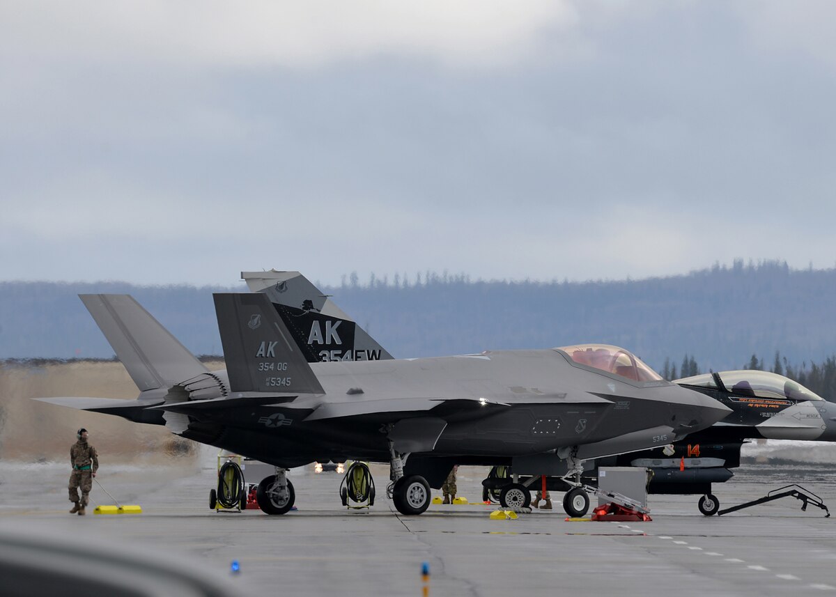 U.S. Air Force Staff Sgt. Steven Krutke, an F-35 avionics system craftsman with the 356th Aircraft Maintenance Unit (AMU), prepares to place chalks for one of the first of two F-35A Lightning II fifth-generation aircraft assigned to the 356th Fighter Squadron after its arrival at Eielson Air Force Base, Alaska, April 21, 2020.