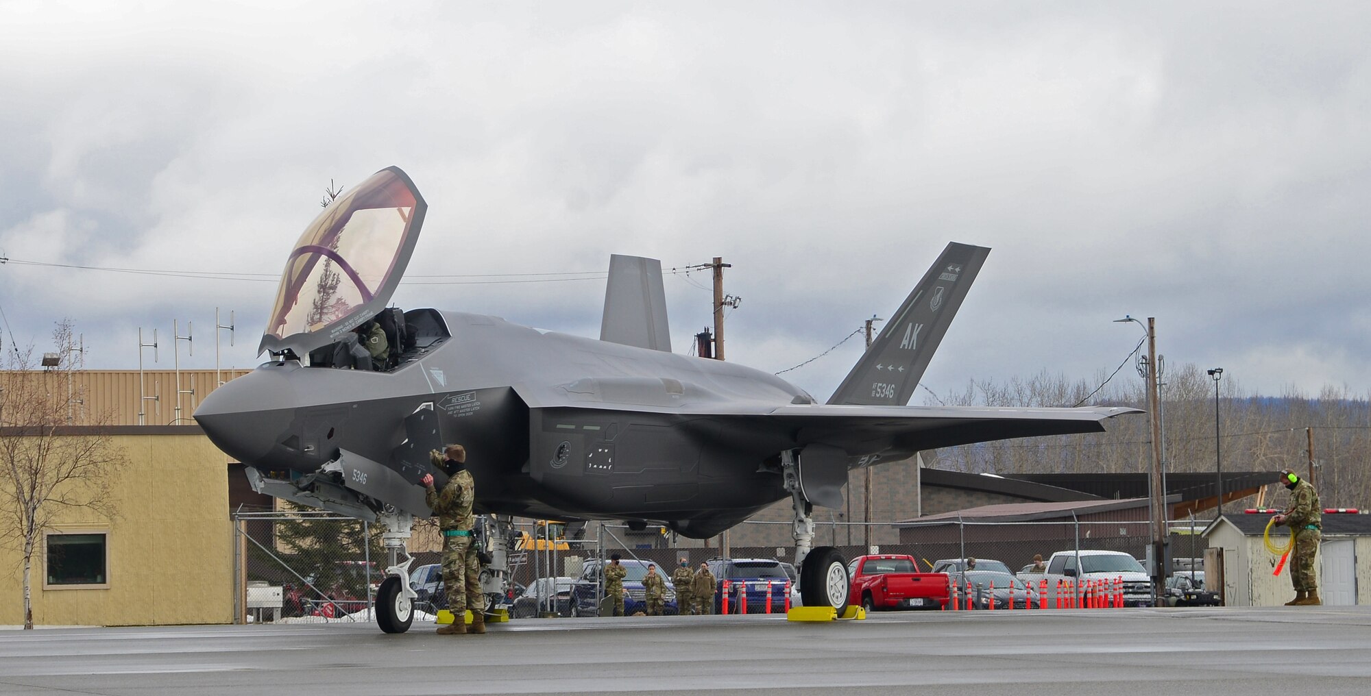 U.S. Air Force Staff Sgt. Christopher Trimarco and Staff Sgt. Kyle Fong, both from the 356th Aircraft Maintenance Unit, perform post flight procedures on the squadron’s first assigned F-35A Lighting II fifth-generation fighter at Eielson Air Force Base, Alaska, April 21, 2020.