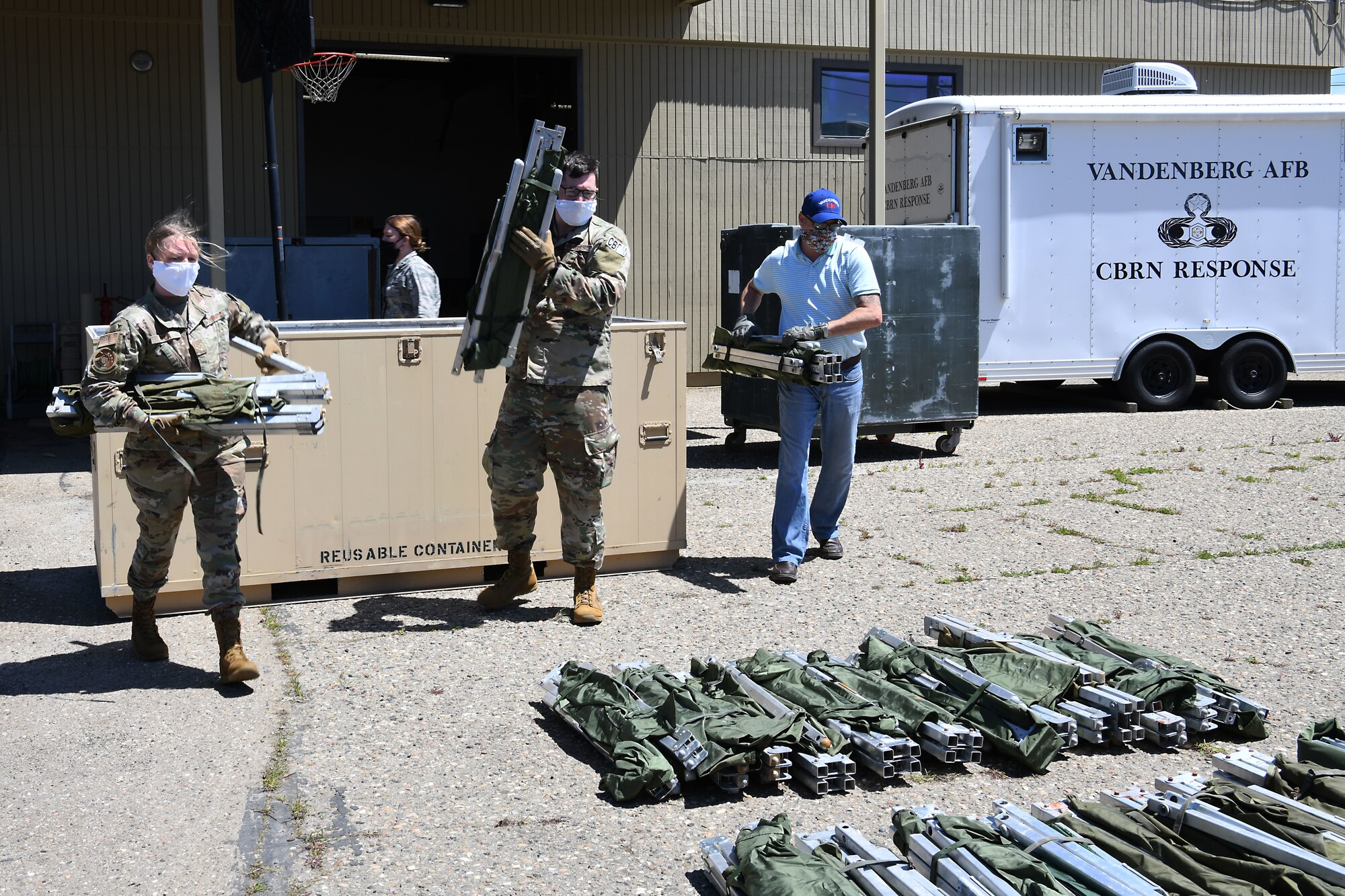 Members of the 30th Civil Engineer Squadron count cots April 22, 2020, at Vandenberg Air Force Base, Calif.