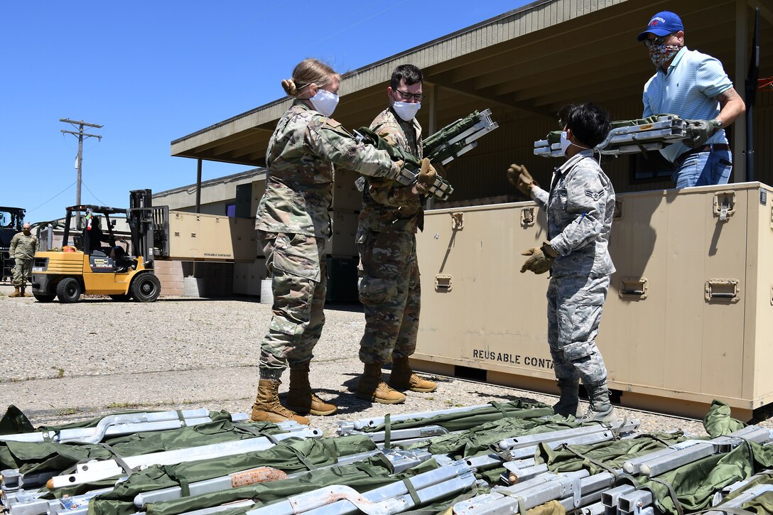 Members of the 30th Civil Engineer Squadron count cots April 22, 2020, at Vandenberg Air Force Base, Calif.