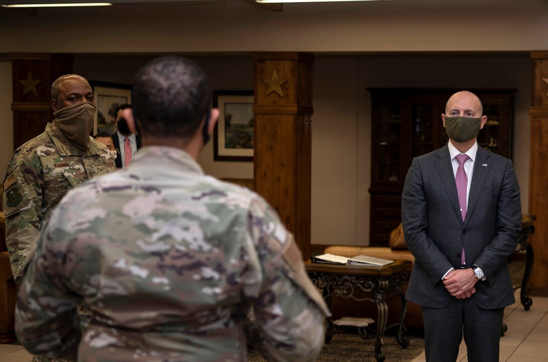 individuals listen to a briefing