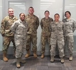 Air Force Reserve Citizen Airmen take a moment during preparations to deploy to New York area to help battle COVID-19 April, 22, 2020 at Joint Base San Antonio-Lackland, Texas.