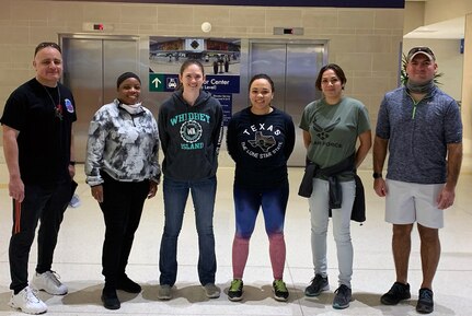 Air Force Reserve Citizen Airmen take a moment at the San Antonio International Airport prior to deploying to New York area to help battle COVID-19 April, 23, 2020.