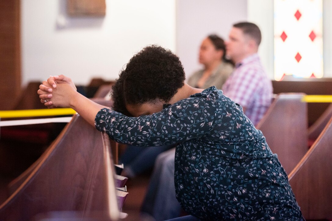 U.S. Air Force Tech. Sgt. Erica Hood, 39th Logistics Readiness Squadron non-commissioned officer in charge of readiness, prays during a recorded worship service April 18, 2020, at Incirlik Air Base, Turkey. Since the outbreak of COVID-19, chaplains at the 39th Air Base Wing called on members of the community to look after each other and ensure they are well while still exercising precautions as detailed by the Centers for Disease Control. (U.S. Air Force photo by Staff Sgt. Joshua Magbanua)