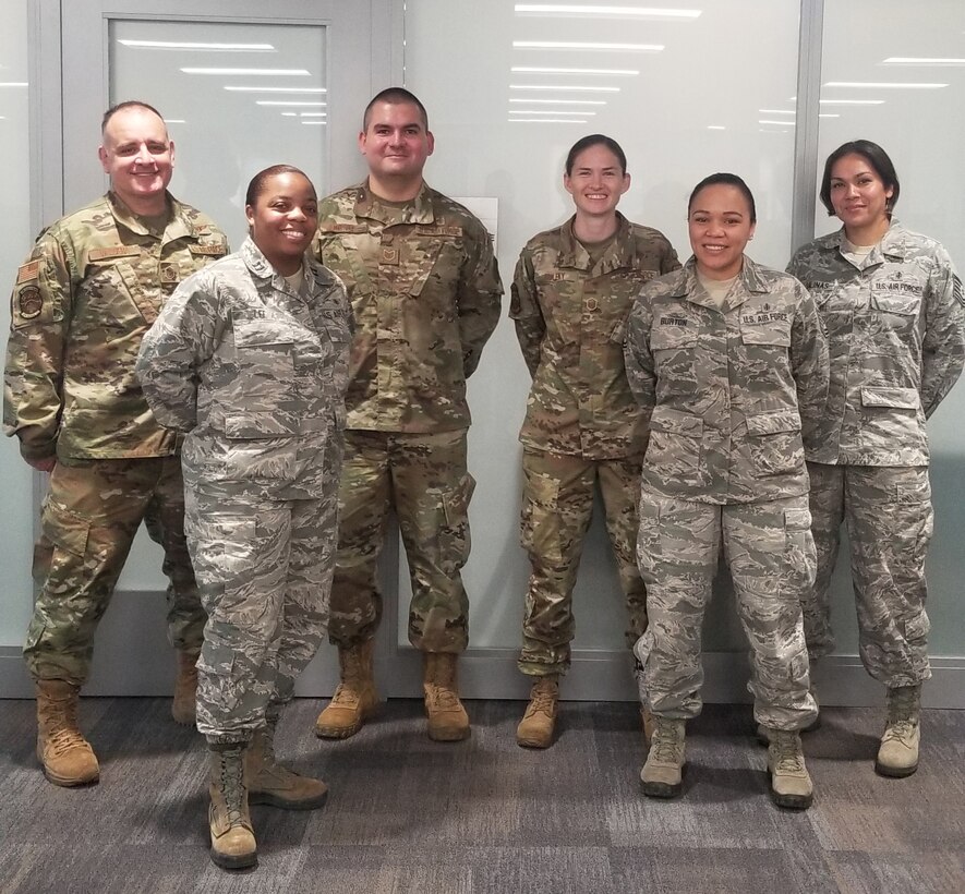 Air Force Reserve Citizen Airmen take a moment during preparations to deploy to New York area to help battle COVID-19 April, 22, 2020 at Joint Base San Antonio-Lackland, Texas.