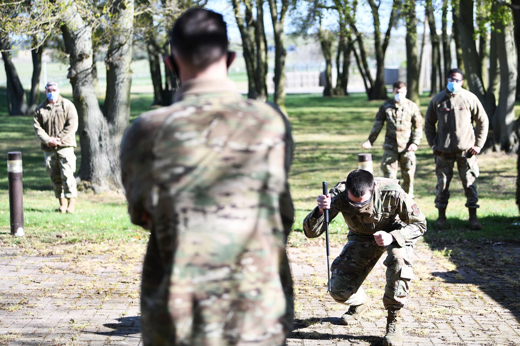 A Liberty Wing Airman practices closing an expandable tactical baton during security forces augmentee training at Royal Air Force Lakenheath, England, April 15, 2020. 48th Security Forces Augmentee Program volunteers participate in a three-day course in preparation for law enforcement duties. (U.S. Air Force photo by Senior Airman Shanice Williams-Jones)