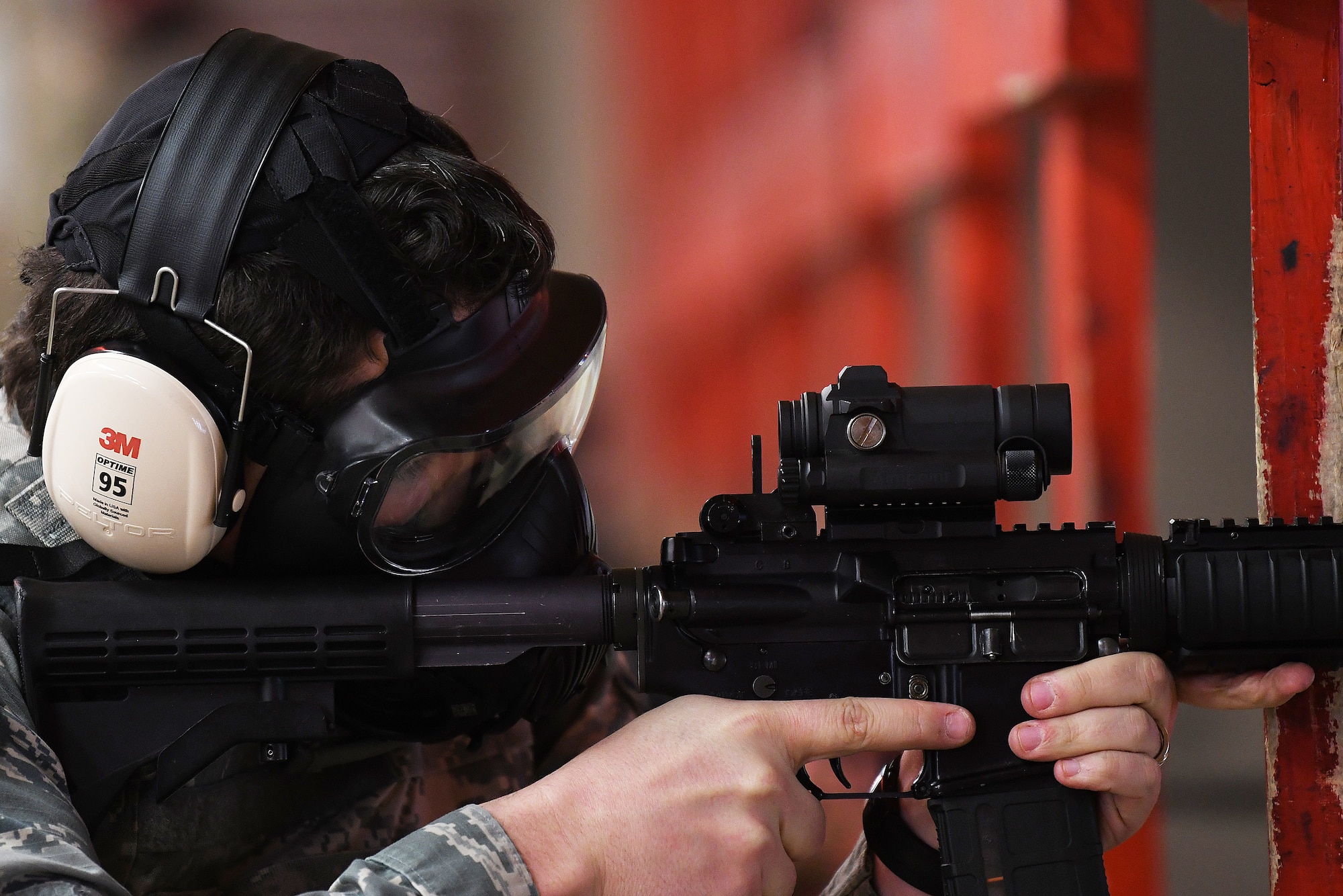 A security forces augmentee in training fires an M4 Carbine assault rifle during training at Royal Air Force Feltwell, England, April 17, 2020. Augmentees provide essential support to the security force's mission to protect, defend, and fight to enable Air Force, joint and allied missions. (U.S. Air Force photo by Senior Airman Shanice Williams-Jones)