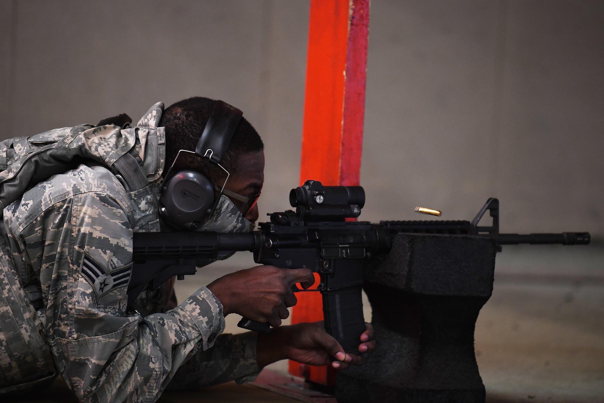 A security forces augmentee in training fires an M4 Carbine assault rifle during training at Royal Air Force Feltwell, England, April 17, 2020. The Security Forces Augmentee Program consists of a three-day course of classroom instructions and hands-on training. (U.S. Air Force photo by Senior Airman Shanice Williams-Jones)