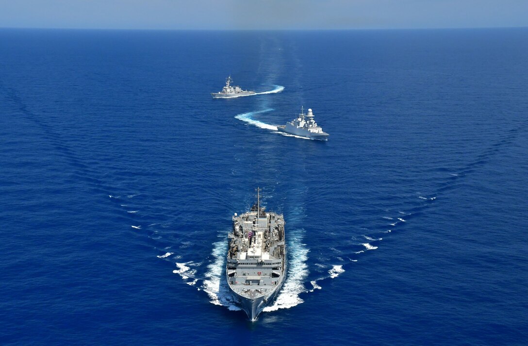 200422-N-NO090-0002 MEDITERRANEAN SEA- The Arleigh Burke-class guided-missile destroyer USS Porter (DDG 78), USNS Supply (T-AOE 6), and ITS Federico Martinengo (F 596) conduct a photo exercise (PHOTOEX) while conducting joint operations to ensure maritime security in the Mediterranean Sea, 22 April. The frequent seamless operations between the Italian and American navies demonstrate strength and professionalism inherent in steady, practiced partnership. U.S. 6th Fleet, headquartered in Naples, Italy, conducts the full spectrum of joint and naval operations, often in concert with allied and interagency partners, in order to advance U.S. national interests and security and stability in Europe and Africa. (Photo courtesy of U.S. Navy)