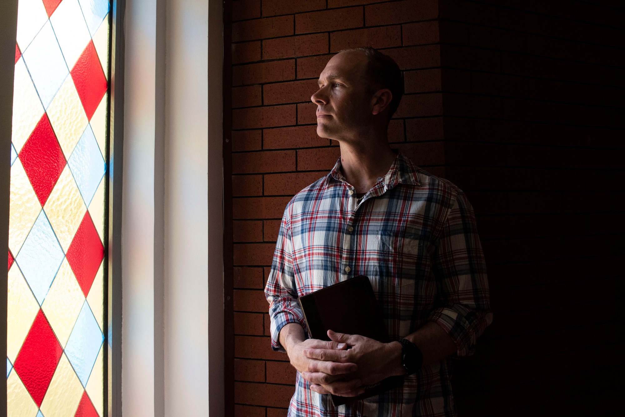 U.S. Air Force Capt. Samuel McClellan, 39th Air Base Wing chaplain, poses for a photo before conducting a worship service April 18, 2020, at Incirlik Air Base, Turkey. Amidst the COVID-19 pandemic, the chaplain encouraged people not to be overcome by fear, saying humankind has faced innumerable challenges before and survived. (U.S. Air Force photo by Staff Sgt. Joshua Magbanua)