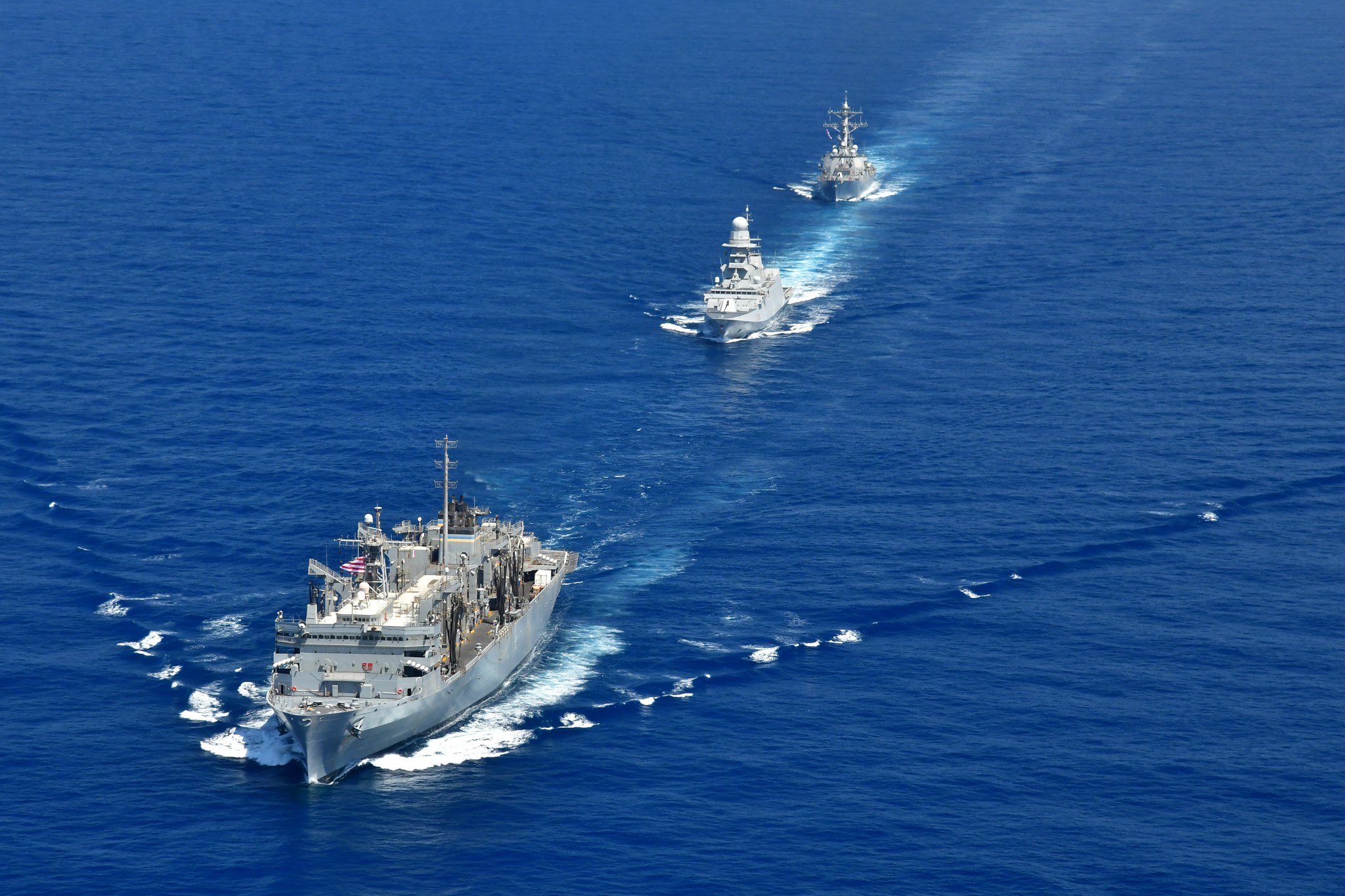 200422-N-NO090-0003 MEDITERRANEAN SEA- The Arleigh Burke-class guided-missile destroyer USS Porter (DDG 78), USNS Supply (T-AOE 6), and ITS Federico Martinengo (F 596) conduct a photo exercise (PHOTOEX) while conducting joint operations to ensure maritime security in the Mediterranean Sea, 22 April. The frequent seamless operations between the Italian and American navies demonstrate strength and professionalism inherent in steady, practiced partnership. U.S. 6th Fleet, headquartered in Naples, Italy, conducts the full spectrum of joint and naval operations, often in concert with allied and interagency partners, in order to advance U.S. national interests and security and stability in Europe and Africa. (Photo courtesy of U.S. Navy)