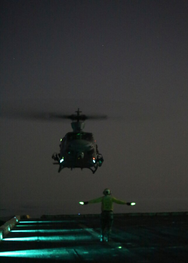 200407-M-MV109-1120 U.S. 5TH FLEET AREA OF OPERATIONS (April 7, 2020) A U.S. Marine Corps UH-1Y Venom assigned to Marine Medium Tiltrotor Squadron (VMM) 365 (reinforced), 26th Marine Expeditionary Unit (MEU), prepares to land on the flight deck of the amphibious transport dock USS New York (LPD 21) April 7, 2020. New York, with embarked 26th MEU, is deployed to the U.S. 5th Fleet area of operations in support of naval operations to ensure maritime stability and security in the Central Region, connecting the Mediterranean and Pacific through the Western Indian Ocean and three strategic choke points. (Marine Corps photo by Staff Sgt. Patricia A. Morris)