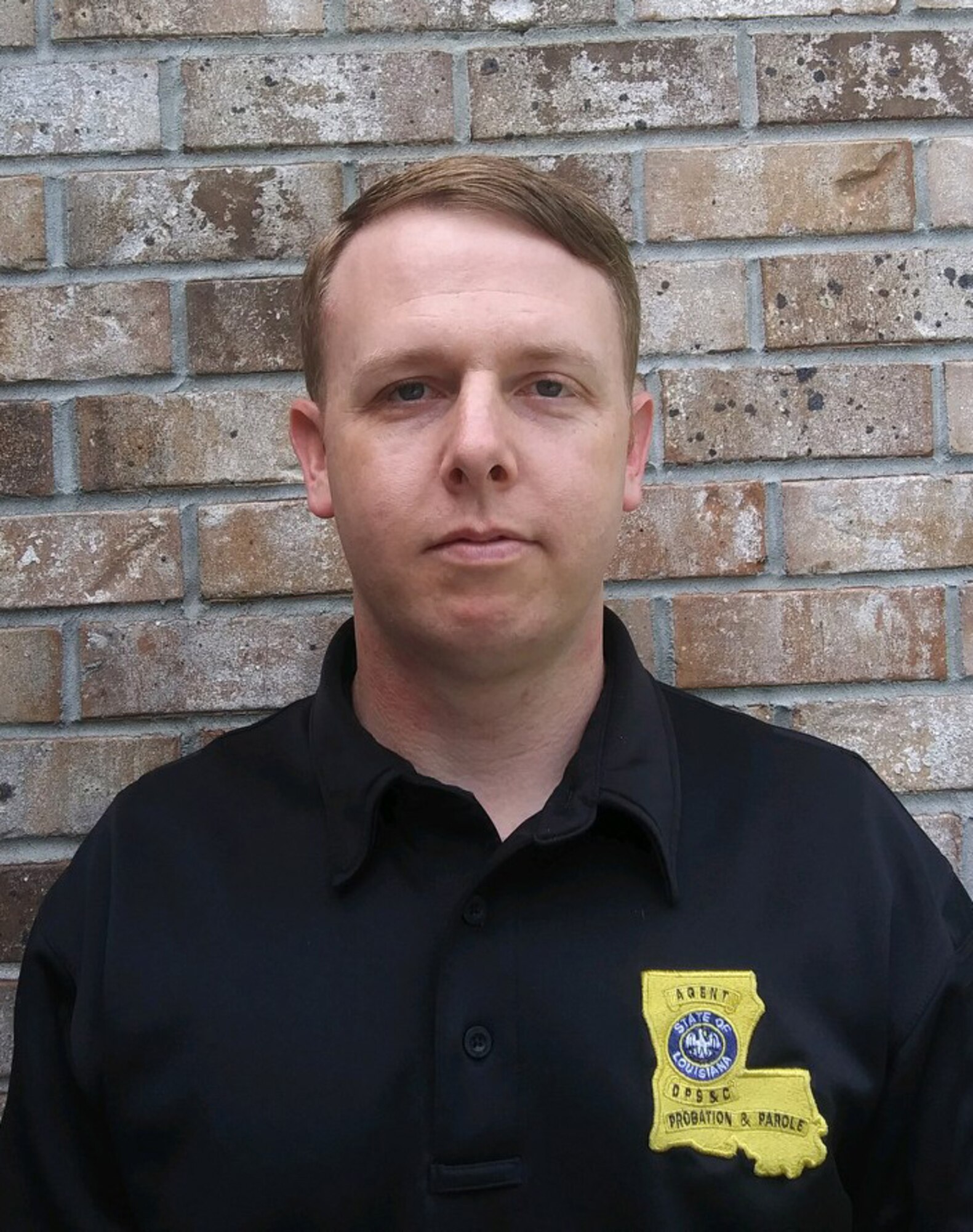 Louisiana Division of Probation and Parole state agent Jerry Primes poses for a photo before starting his shift during the COVID-19 crisis, April 10, 2020. Primes, a senior airman, works as a fuel system specialist in the 403rd Maintenance Squadron of the 403rd Wing at Keesler Air Force Base, Miss. (courtesy photo)