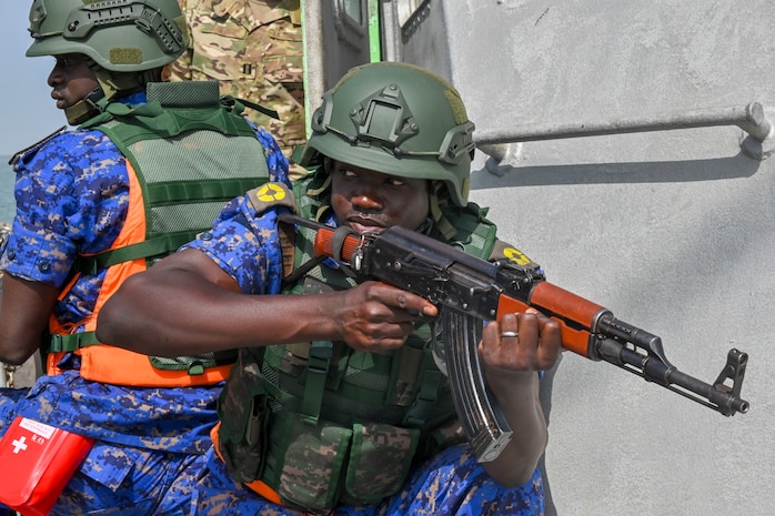 Members of the Gambia Navy boarding team provide security while conducting a simulated drug smuggling and human trafficking scenario during Exercise Obangame Express 2019 in Banjul, Gambia, March 16, 2019.