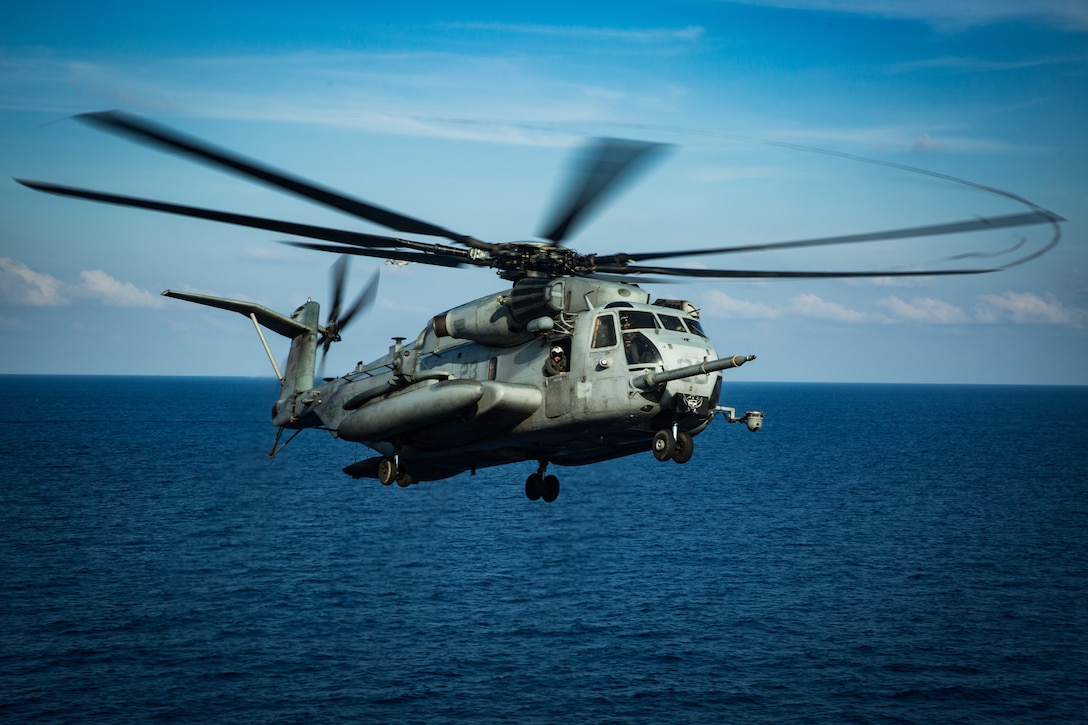 A CH-53E Super Stallion helicopter lands on the flight deck of amphibious assault ship USS America during flight operations, April 18.