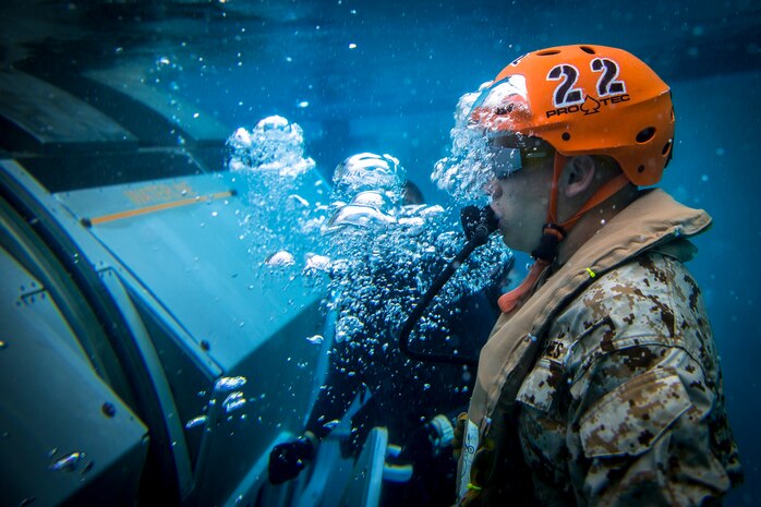 A U.S. Marine escapes from a Modular Amphibious Egress Trainer during underwater egress training at the Infantry Immersion Trainer facility, Marine Corps Base Camp Pendleton, California, March 19.