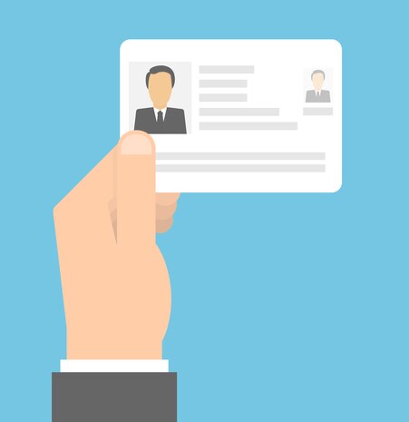 Graphic shows hand holding ID card with information blacked out